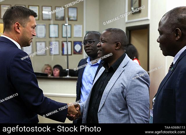 RUSSIA, ST PETERSBURG - JULY 26, 2023: Minister of Foreign Affairs and International Cooperation of the Republic of Zambia Stanley Kakubo (C front) shakes hands...