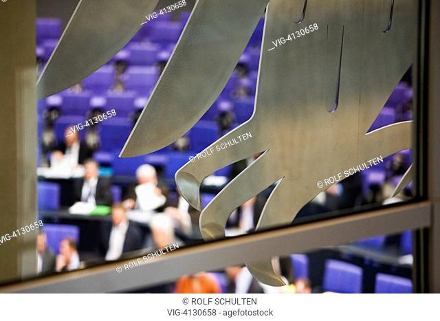 GERMANY, BERLIN, : German Bundestag: Session in the plenary hall of the Reichstag building. Parts of the federal eagle in the foreground