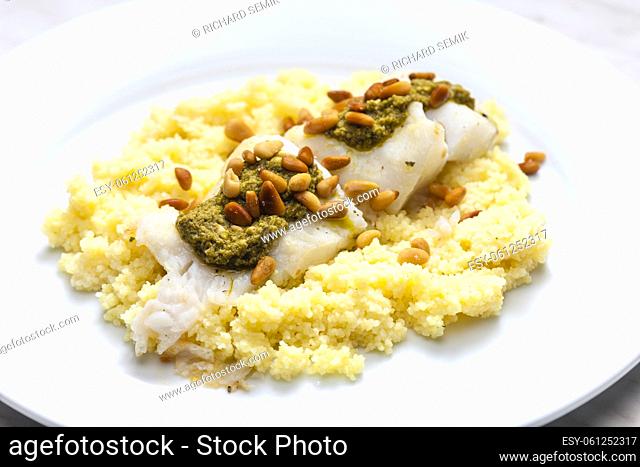 cod with green pesto and pine seeds with couscous