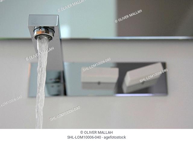 Modern faucet with running water