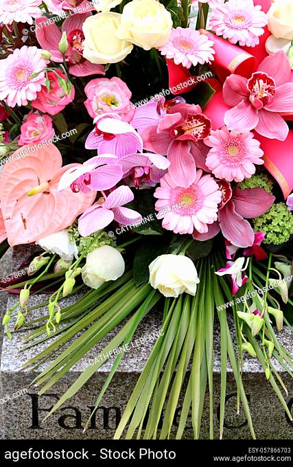 Bouquet of flowers on a gravestone. Pere Lachaise cemetery. Paris. Ile-de-France. France. Europe