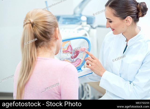 Childless woman in fertility clinic talking to doctor about issues having children