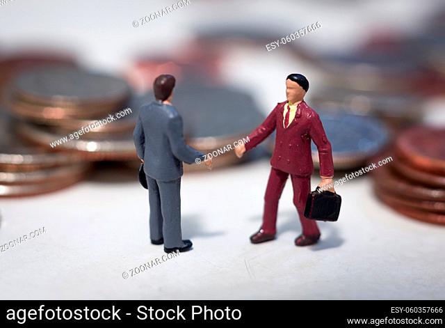 Two small buisness men making a deal