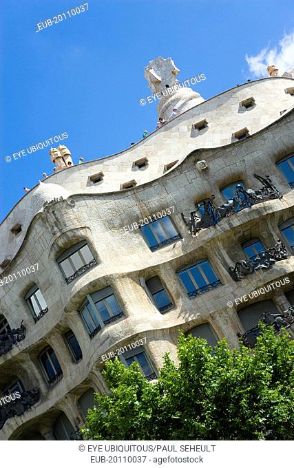 Facade of Casa Mila apartment building known as La Pedrera or Stone Quarry designed by Antoni Gaudi in the Eixample district