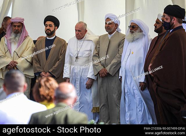06 March 2021, Iraq, Nasiriyah: Pope Francis (C) and clerics from different sects in Iraq attend an interreligious meeting in the Sumerian city-state Ur