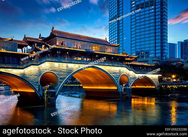 Famous landmark of Chengdu - Anshun bridge over Jin River illuminated at night, Chengdue, Sichuan , China