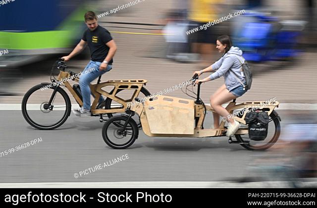 15 July 2022, Hessen, Frankfurt/Main: Visitors to the international bicycle trade show Eurobike are out and about with test bikes at the Frankfurt exhibition...