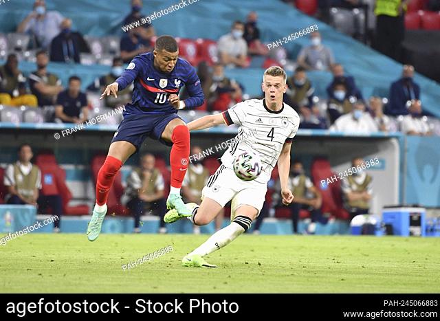 Matthias GINTER r. (GER) in duels versus Kylian MBAPPE (FRA), action, group stage, preliminary round group F, game M12, France (FRA) - Germany (GER), on June 15