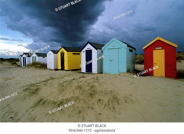 Beach huts under stormy sky, Southwold, Suffolk, England, United Kingdom, Europe