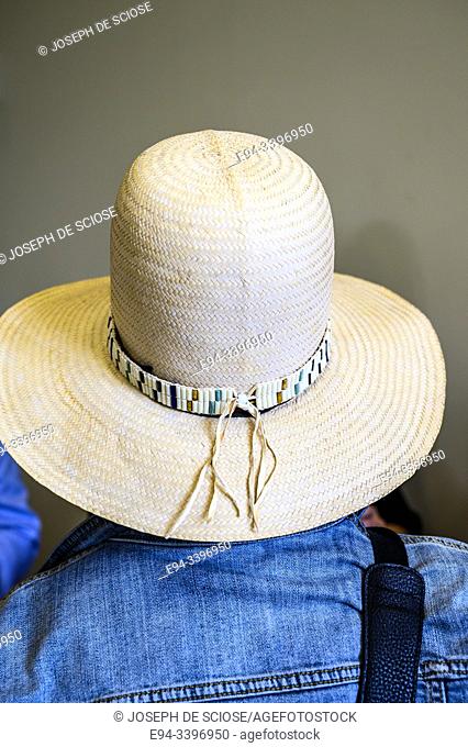 A big straw hat on a person's head