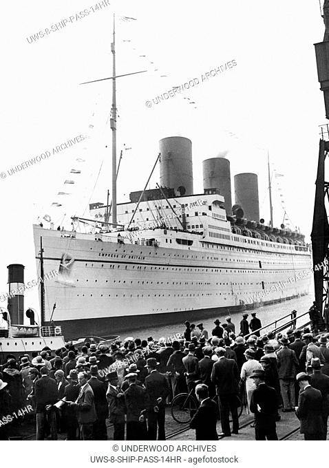 Southhampton, England: August 26, 1932 Crowds wating at dockside as the Empress of Britain arrives with the Ottawa Conference delegates on board