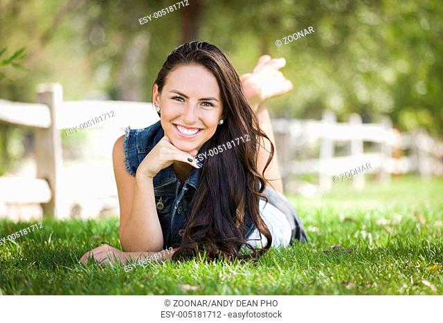 Mixed Race Girl Portrait Laying in Grass