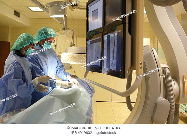 Interventional radiology, doctor with nurse during surgery, Karlovy Vary, Czech Republic, Europe