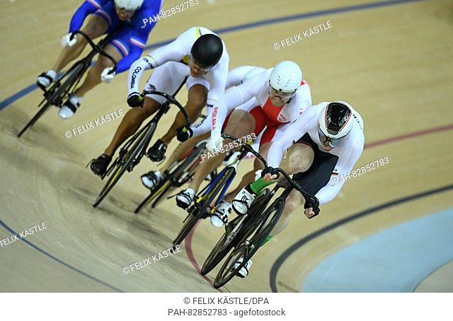 (R-L) Joachim Eilers of Germany, Krzysztof Maksel of Poland and Fabian Hernando Puerta Zapata of Colombia in action during the Men's Keirin Second Round of the...