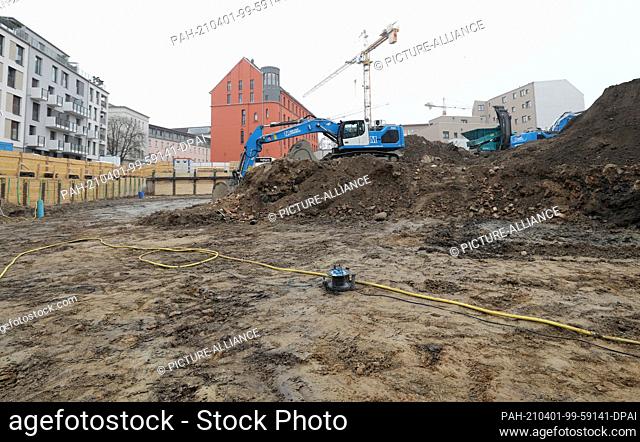 01 April 2021, Mecklenburg-Western Pomerania, Rostock: The Glatter Aal site in the centre of the Hanseatic city. During earthworks for a new residential and...