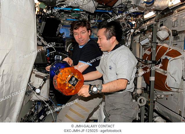 NASA astronaut Michael Barratt (left) and Japan Aerospace Exploration Agency (JAXA) astronaut Koichi Wakata, both Expedition 20 flight engineers