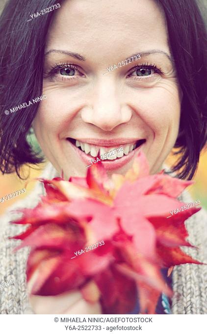Smiling mid adult woman portrait, autumn