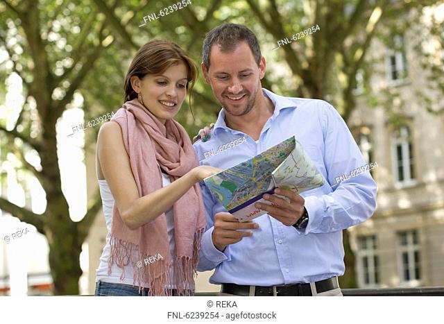 Young couple reading map