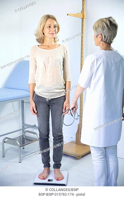 Woman being weighed at the doctor's