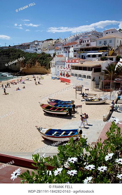 Portugal, Algarve, Carvoeiro, View of Town & Boats on The Beach