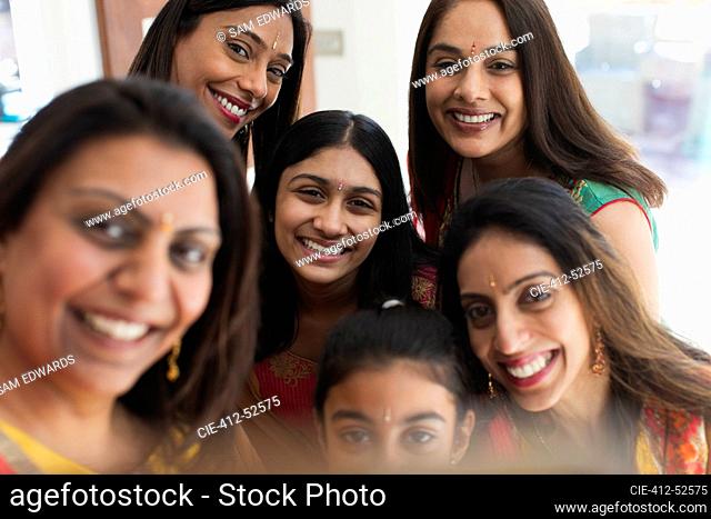 Portrait happy Indian women with bind forehead jewels