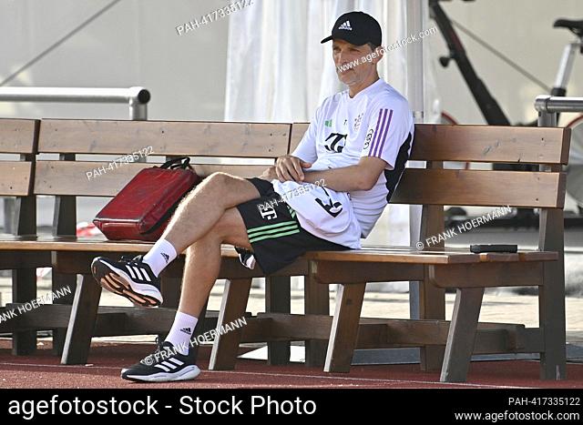 coach Thomas TUCHEL (FC Bayern Munich) sits on a wooden bench, test match FC Bayern Munich - Rottach Egern 27-0 training camp in Rottach Egern on July 18th