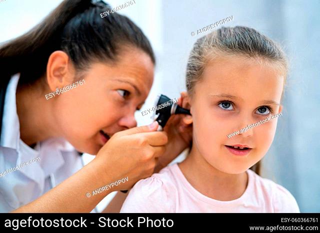Otolaryngology Infection. Child Doctor Checking Ear Using Otoscope