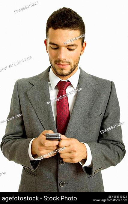 young business man looking to his phone, isolated