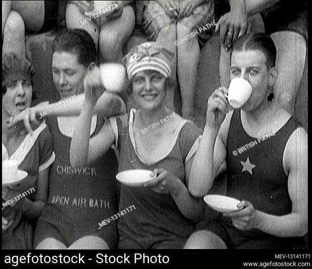 British People Sitting Around and Drinking Cups Of Tea While Wearing Bathing Suits at the Chiswick Open Air Baths - Chiswick, United Kingdom