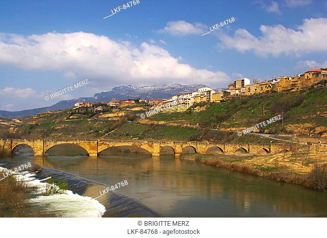 Medieval stone bridge over river, Rio Ebro, in Spring, San Vicente de la Sonsierra, La Rioja, Spain
