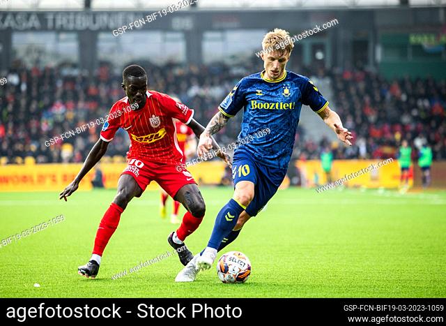 Farum, Denmark. 19th, March 2023. Daniel Wass (10) of Broendby IF and Mohamed Diomande (10) of FC Nordsjaelland seen during the 3F Superliga match between FC...