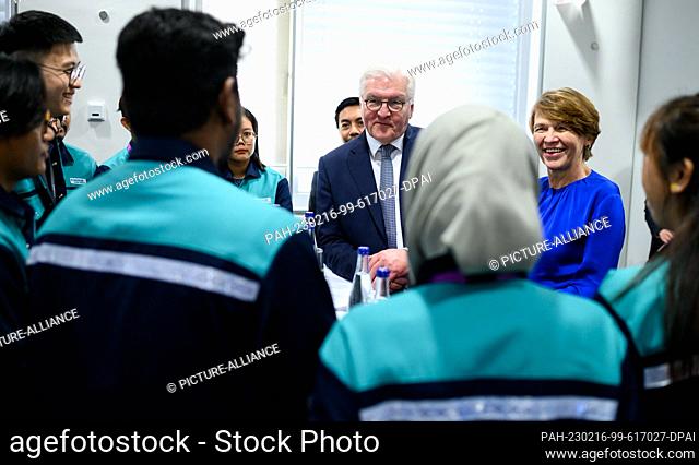 16 February 2023, Malaysia, Penang: German President Frank-Walter Steinmeier (center) and his wife Elke Büdenbender (2nd from right) talk to young trainees...