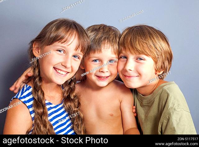 Beautiful portrait of two brothers and a sister