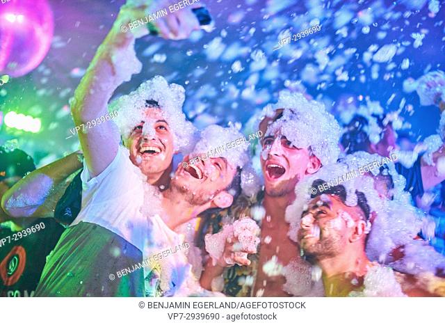 Happy friends taking selfie during foam party at music festival Starbeach in Hersonissos, Crete, Greece, on 06. July 2017