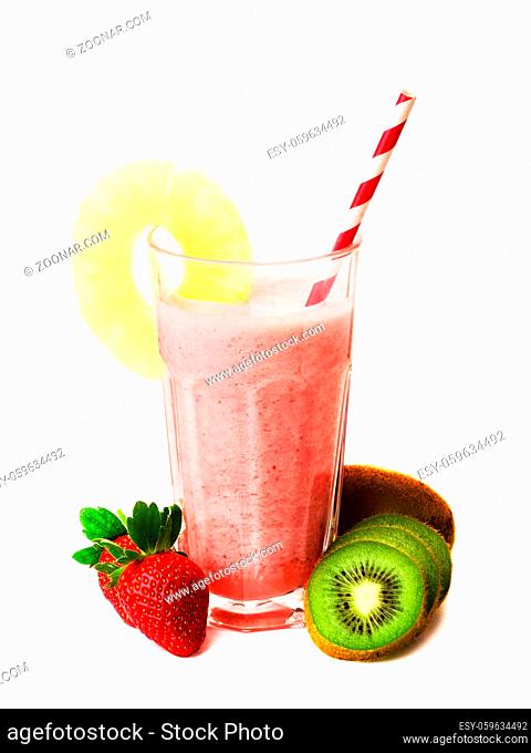 Pink strawberry smoothie in glass with straw and scattered berries, kiwi and a pineapple, pink milkshake, healthy drink isolated on white background