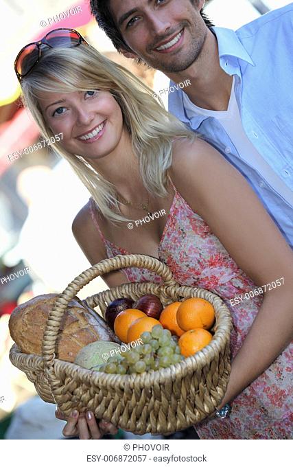 Couple buying fruit