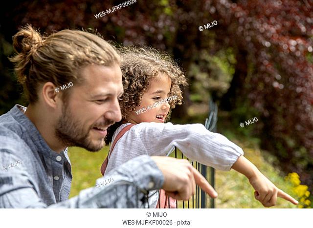 Happy father with son in garden