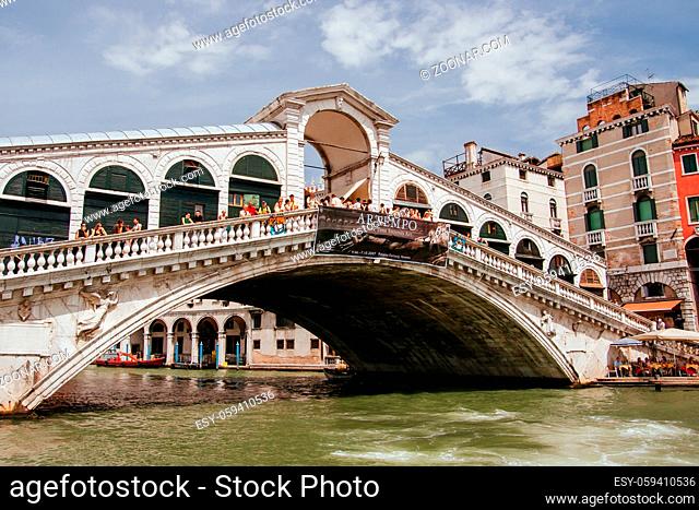 Venice, Italy - June 30th 2007: Venetian gondolas navigating the Grand Canal under the Ponte Di Rialto