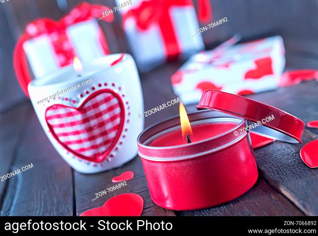 present for valentines day in the box and candle on a table