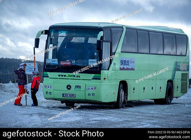 11 February 2020, Saxony, Oberwiesenthal: The ski bus coming from the Czech Republic stands on the top of the Fichtelberg and waits for winter sports...