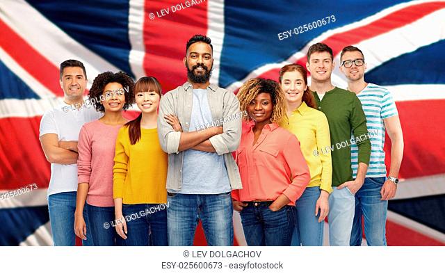 diversity, race, ethnicity and people concept - international group of happy smiling men and women over british or english flag background