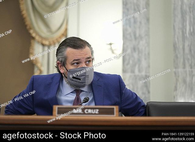 United States Senator Ted Cruz (Republican of Texas), wears a protective mask while arriving to a Senate Commerce, Science and Transportation Committee...