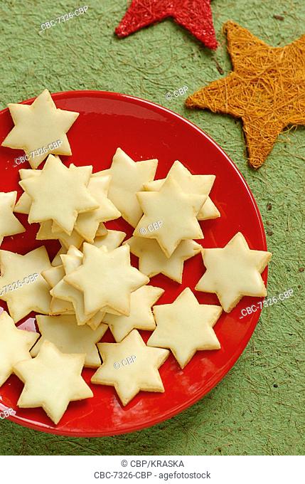 Star Shaped Cookies On A Red Plate