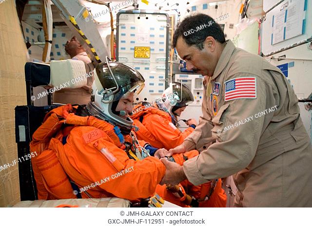 NASA astronauts Greg Chamitoff (foreground) and Andrew Feustel, both STS-134 mission specialists, attired in training versions of their shuttle launch and entry...