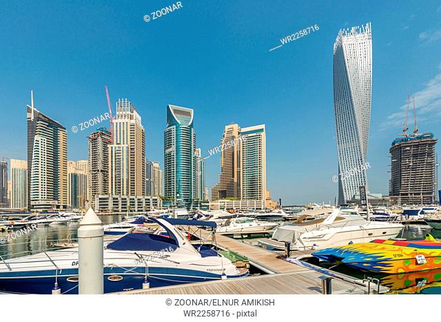 The dubai - august 9, 2014: dubai marina district on august 9 in uae. dubai is fastly developing city in middle east