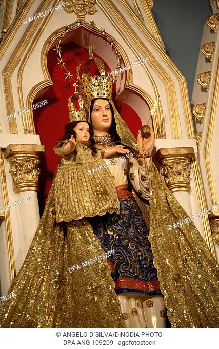 Idol of Mount Mary with child Jesus in hand outside Mount Mary Church ; Mount Mary Festival ; Bandra ; Bombay  Mumbai ; Maharashtra ; India NO PERMISSION