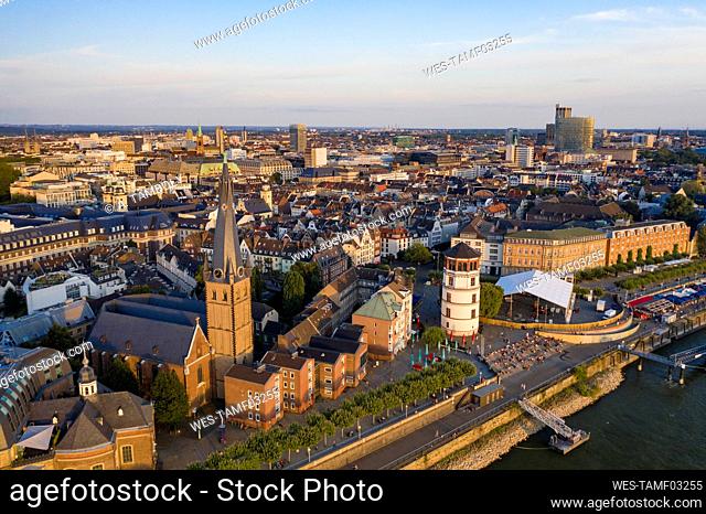 Germany, North Rhine-Westphalia, Dusseldorf, Aerial view of Burgplatz, Schlossturm and Saint Lamberts Church at dusk