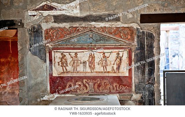 Lararium shrine fresco in atrium of ancient tavern, Pompeii, Italy