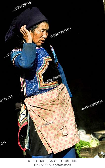 A colorful Hani woman