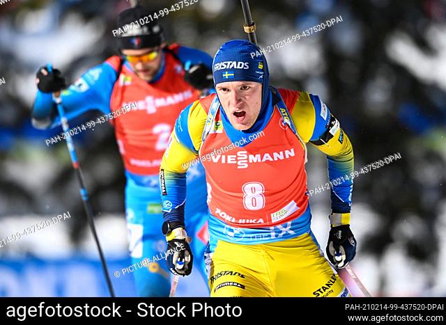 14 February 2021, Slovenia, Pokljuka: Biathlon: World Championship, Pursuit 12.5 km, Men. Sebastian Samuelsson from Sweden ahead of Simon Desthieux from France...